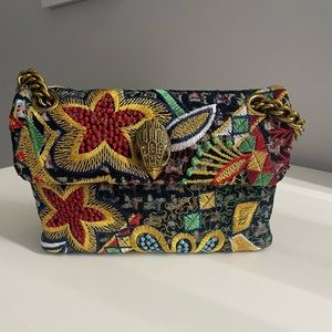 Tweed Mini Kensington tweed fabric stitched into a floral design. Brass Eagle